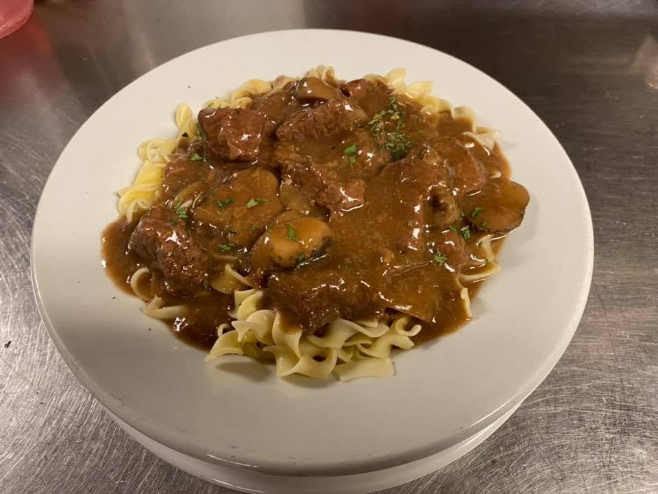 Beef tips over egg noodles at Johnny Dee’s Lounge